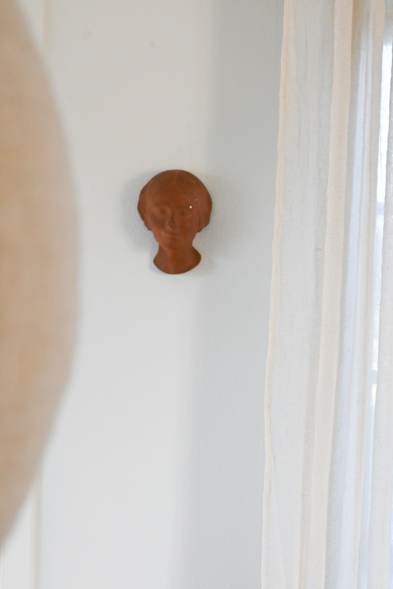 Väggrelief L'Inconnue de la Seine